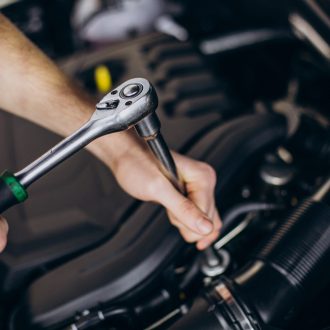 Repair man making car service